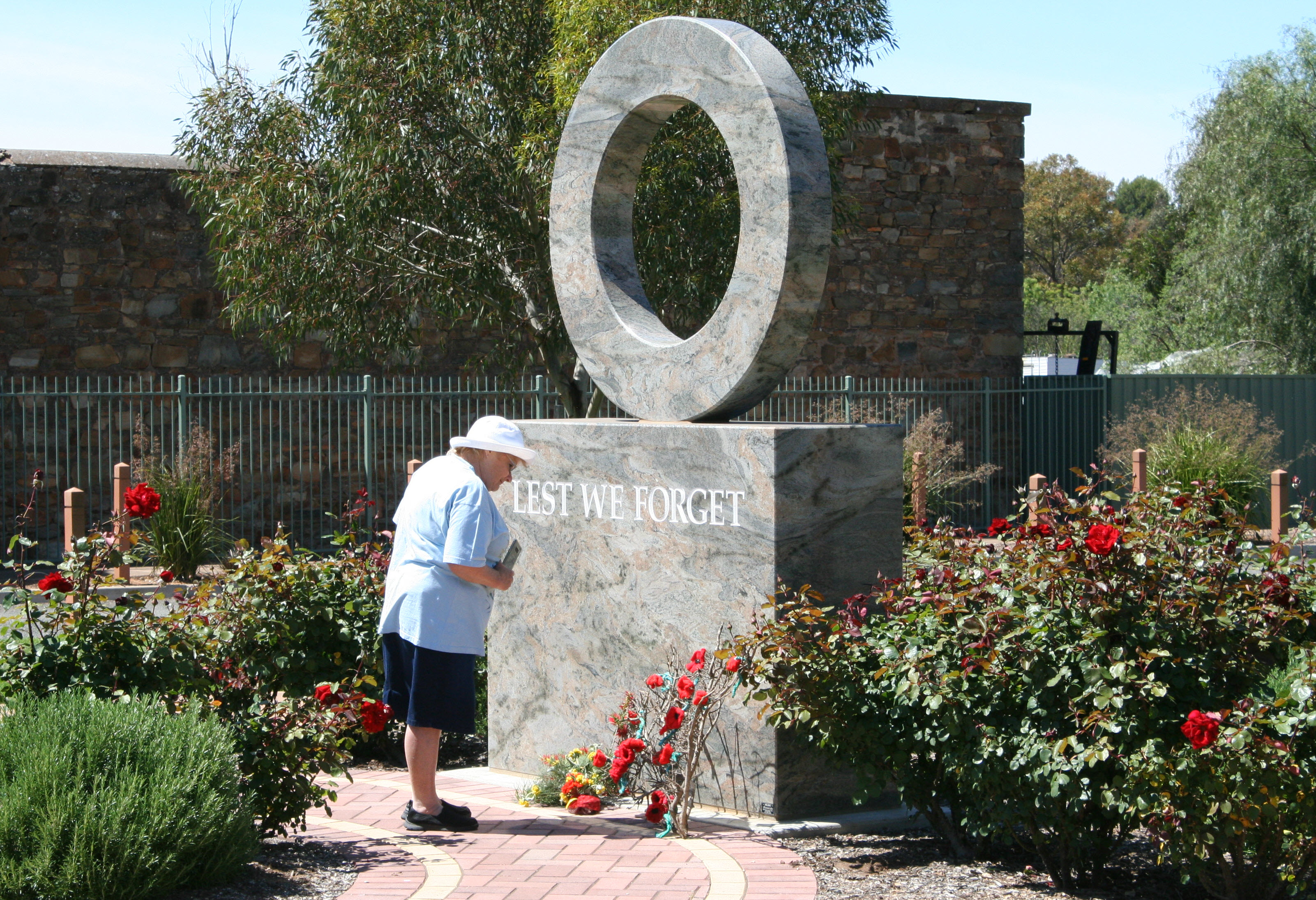 A visitor observing the wreaths.